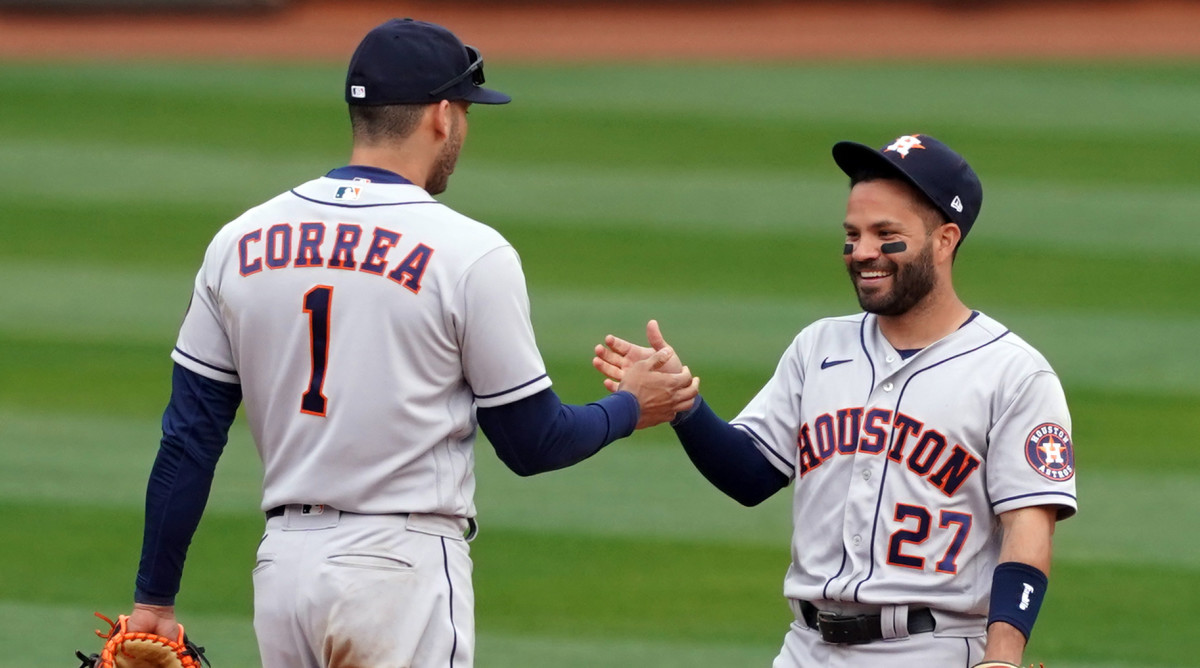 Carlos Correa and Jose Altuve celebrate a win over the A's