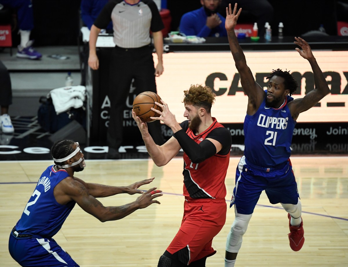 Dec 30, 2020; Los Angeles, California, USA; Portland Trail Blazers center Jusuf Nurkic (27) drives into the key defended by LA Clippers forward Kawhi Leonard (2) and LA Clippers guard Patrick Beverley (21) during the first quarter at Staples Center. Mandatory Credit: Robert Hanashiro-USA TODAY Sports