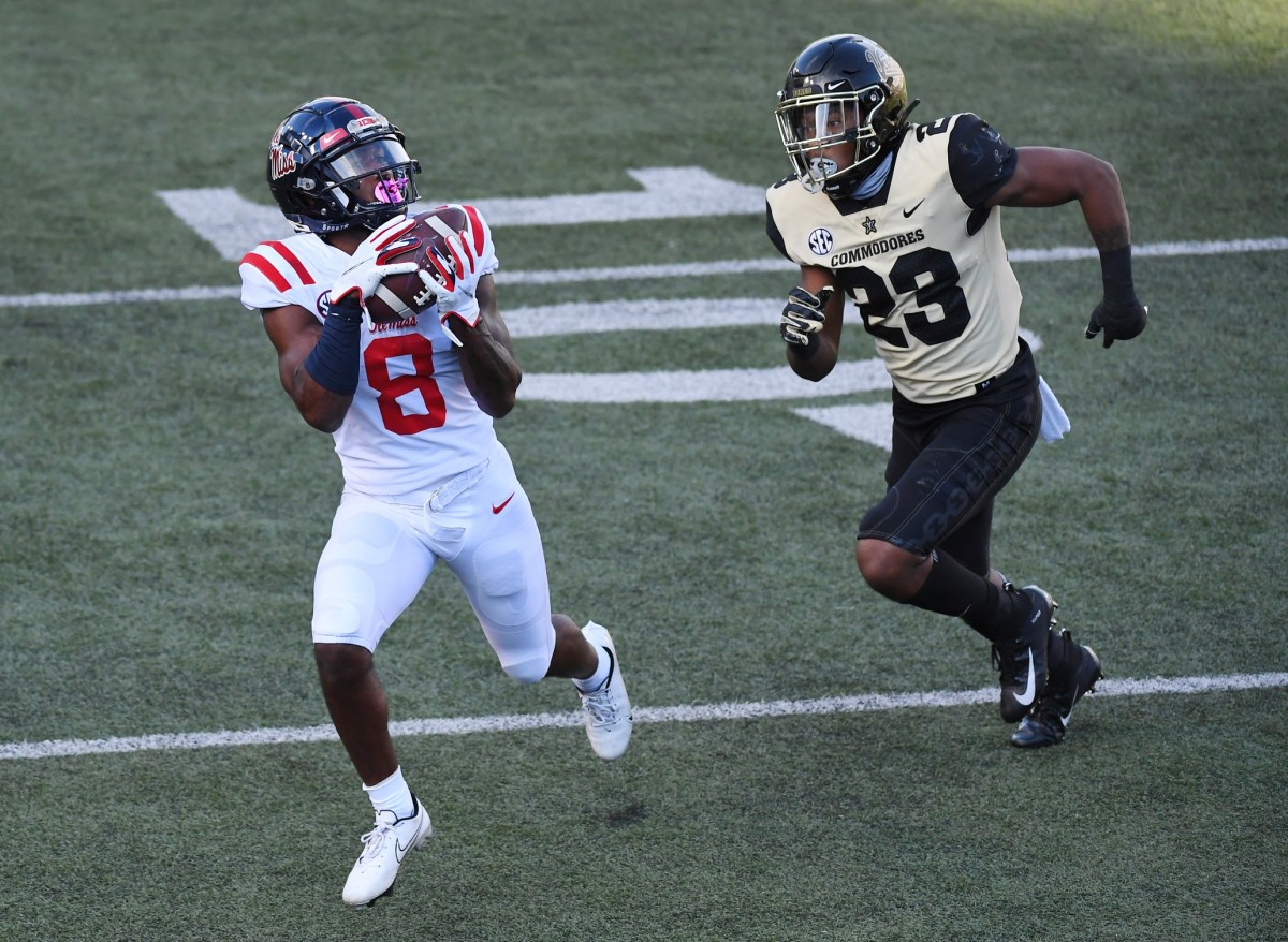 Mississippi Rebels wide receiver Elijah Moore (8) catches a touchdown pass behind coverage from Vanderbilt Commodores cornerback Jaylen Mahoney (23). Mandatory Credit: Christopher Hanewinckel-USA TODAY