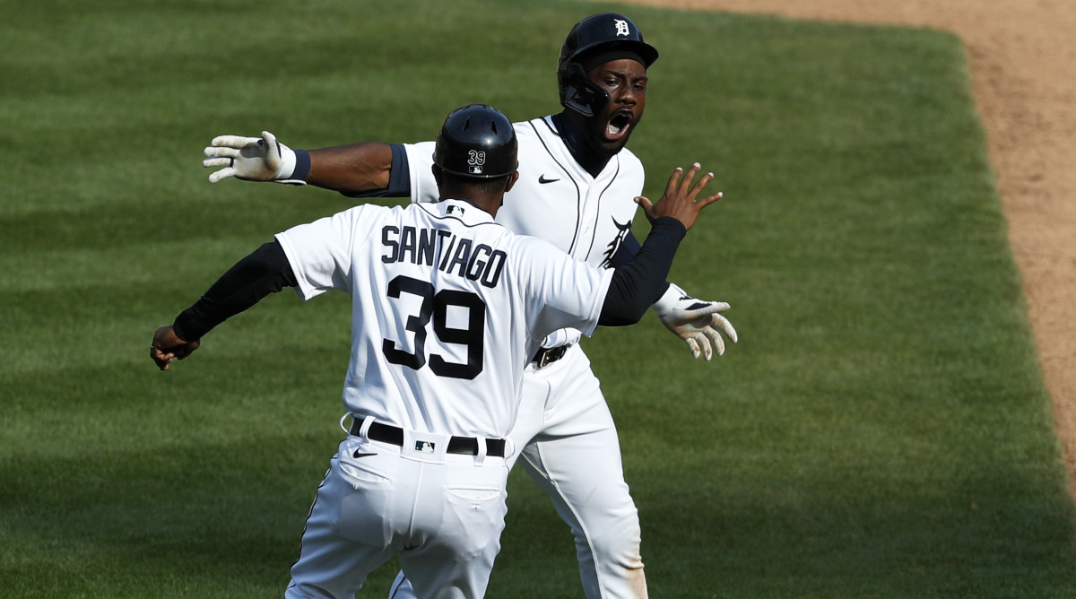 Apr 6, 2021; Detroit, Michigan, USA; Detroit Tigers center fielder Akil Baddoo (60) celebrates with first base coach Ramon Santiago (39) after hitting a walk off single to win the game in the tenth inning against the Minnesota Twins at Comerica Park.