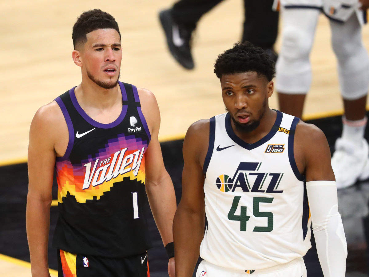 Devin Booker alongside Donovan Mitchell