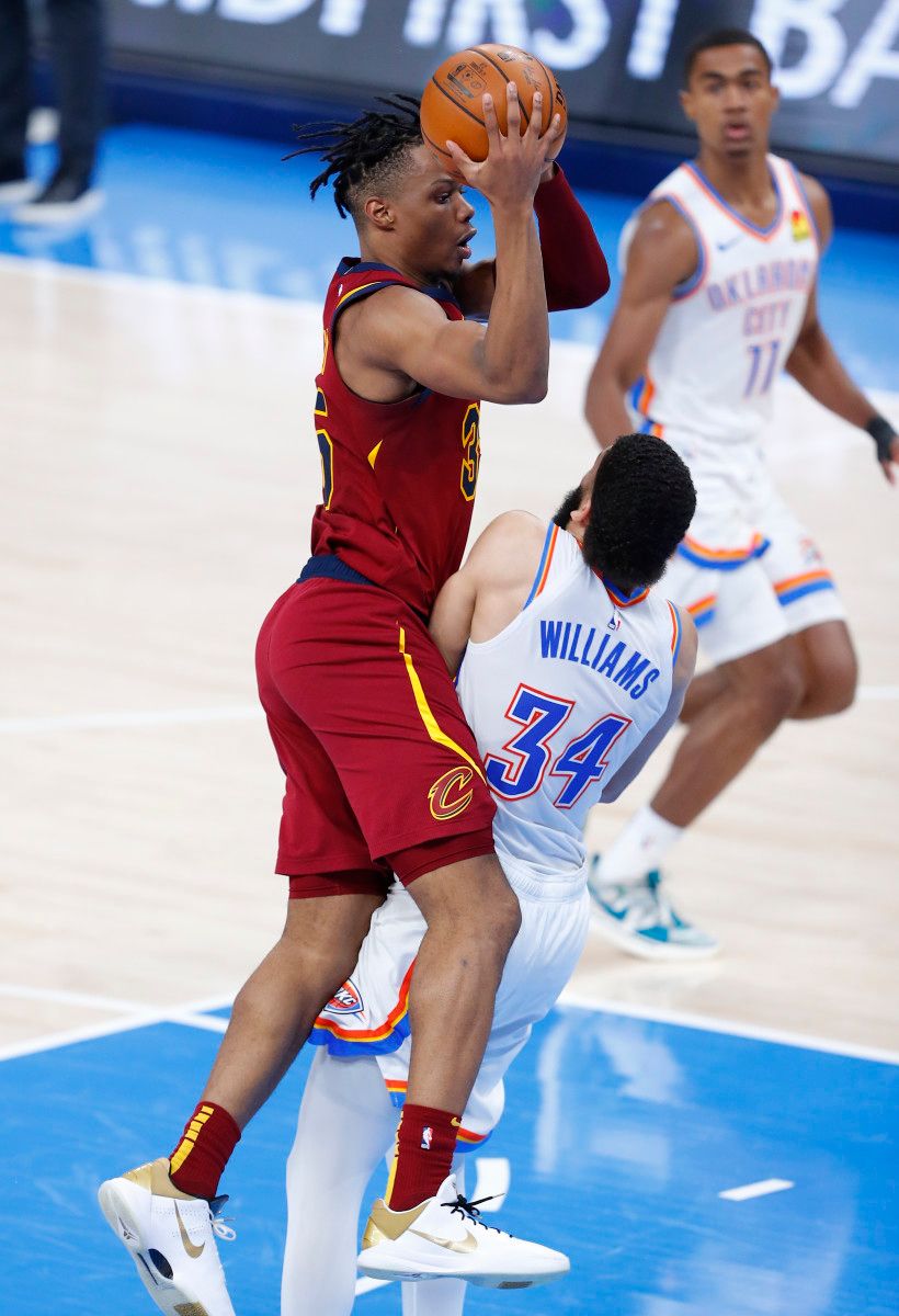 Kenrich Williams sets up to take a charge on the defensive end of the floor