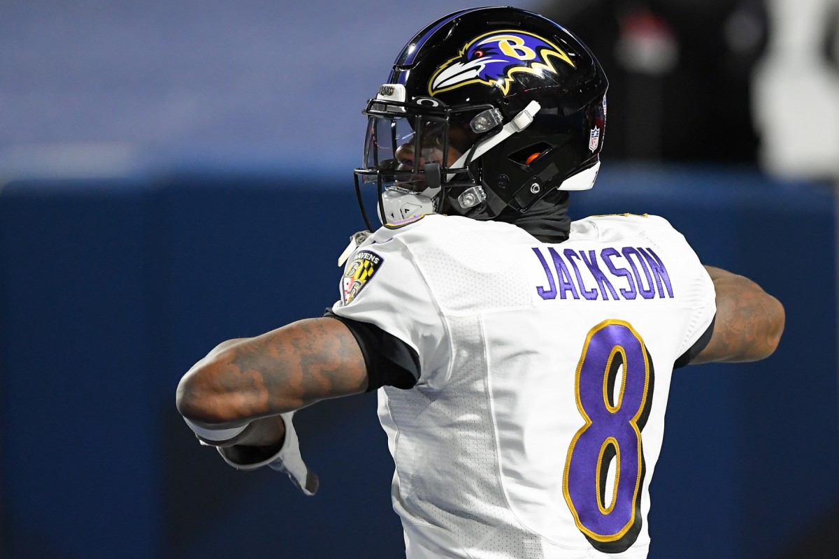 Baltimore Ravens quarterback Lamar Jackson (8) warms up prior to an AFC Divisional Round game Buffalo Bills at Bills Stadium.