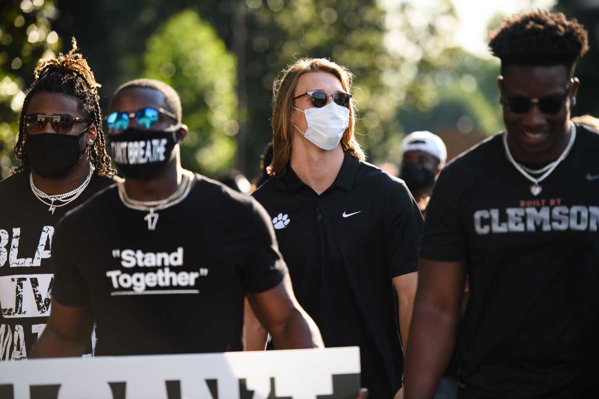 Lawrence (center) helps lead a protest march following the death of George Floyd. © JOSH MORGAN/Staff via Imagn Content Services, LLC