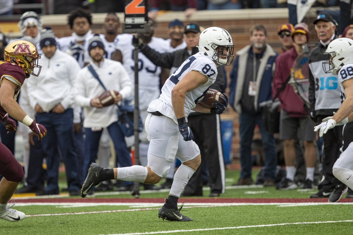 Penn State Nittany Lions tight end Pat Freiermuth (87) rushes with the ball after making a catch against the Minnesota Golden Gophers. Mandatory Credit: Jesse Johnson-USA TODAY 