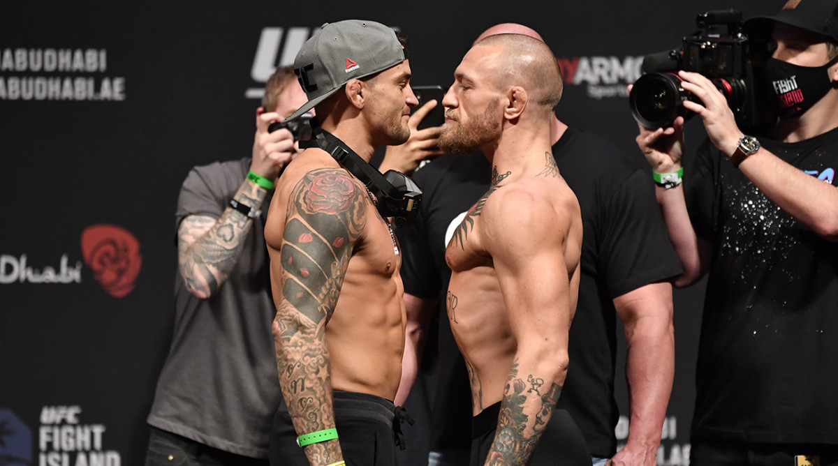 Conor McGregor and Dustin Poirier during the UFC 257 weigh-in.