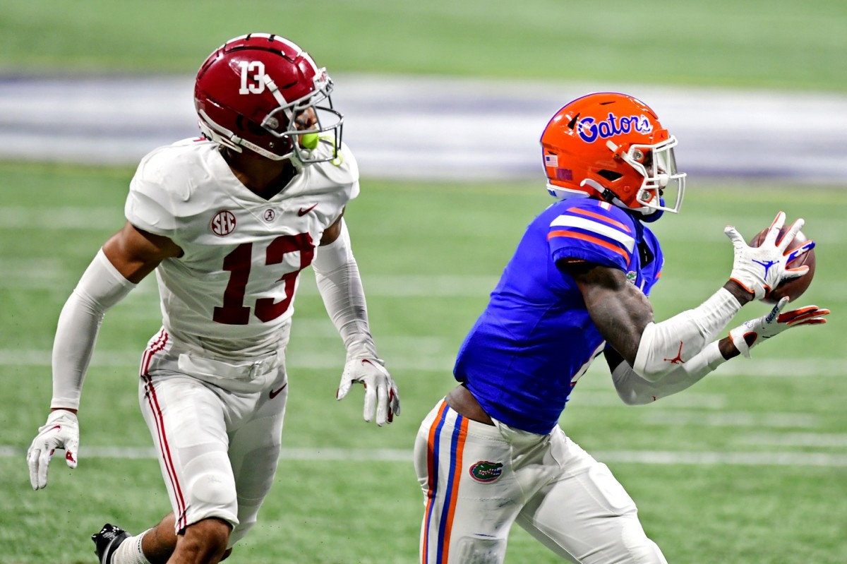 Florida Gators receiver Kadarius Toney (1) makes a catch against Alabama defensive back Malachi Moore in the SEC Championship. Mandatory Credit: Adam Hagy-USA TODAY Sports