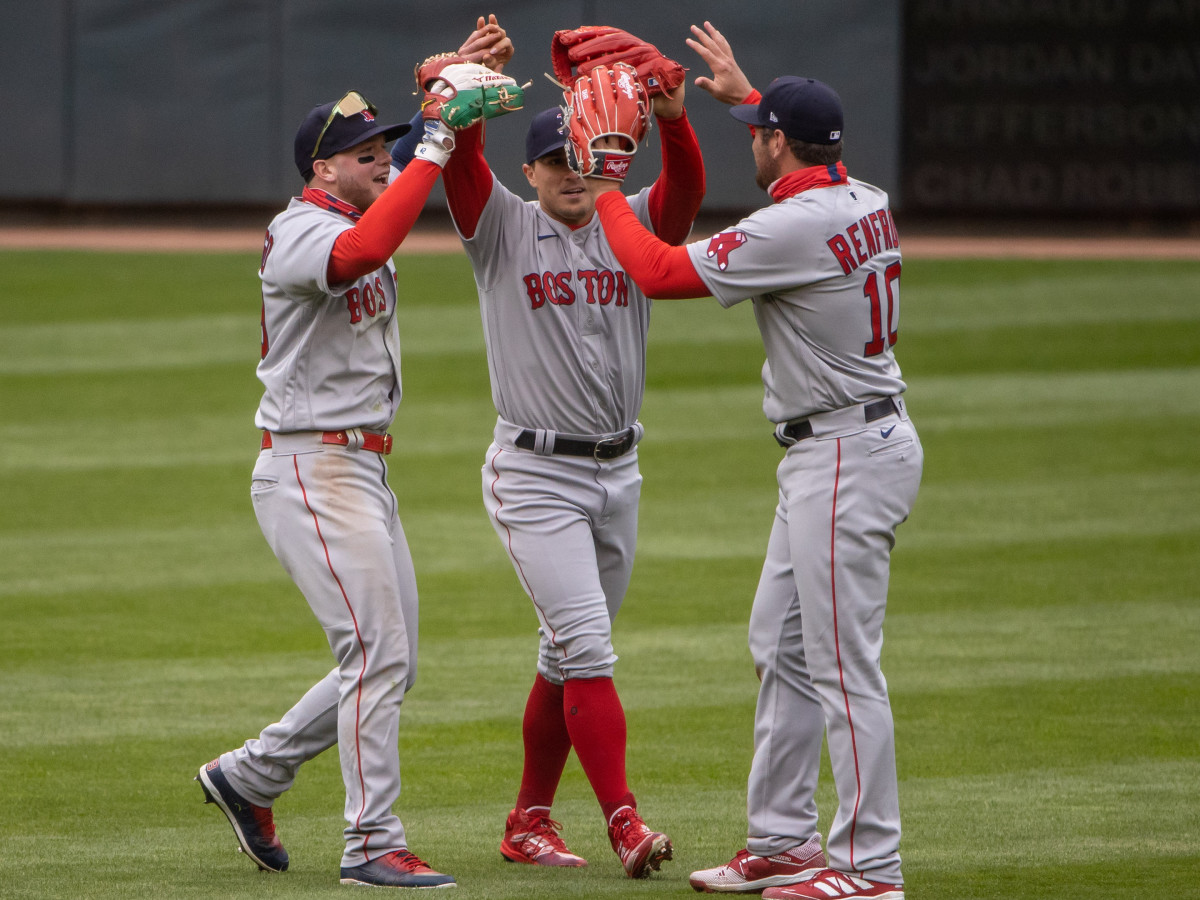 Alex Verdugo, Enrique Hernandez and Hunter Renfroe celebrate a Red Sox win.