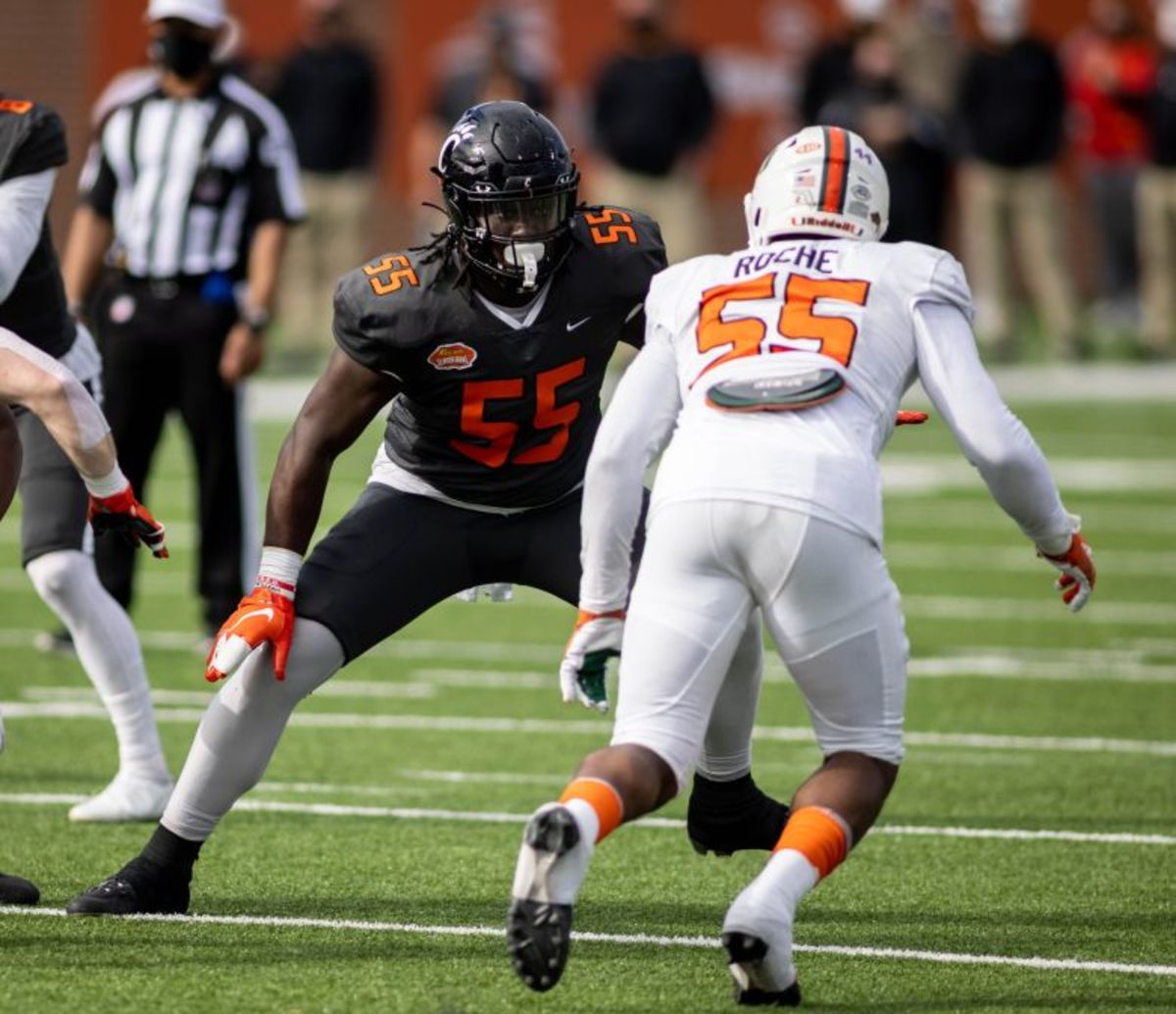 National offensive lineman James Hudson III of Cincinnati (55) faces off against American defensive lineman Quincy Roche of Miami (55) in the first half of the 2021 Senior Bowl at Hancock Whitney Stadium.