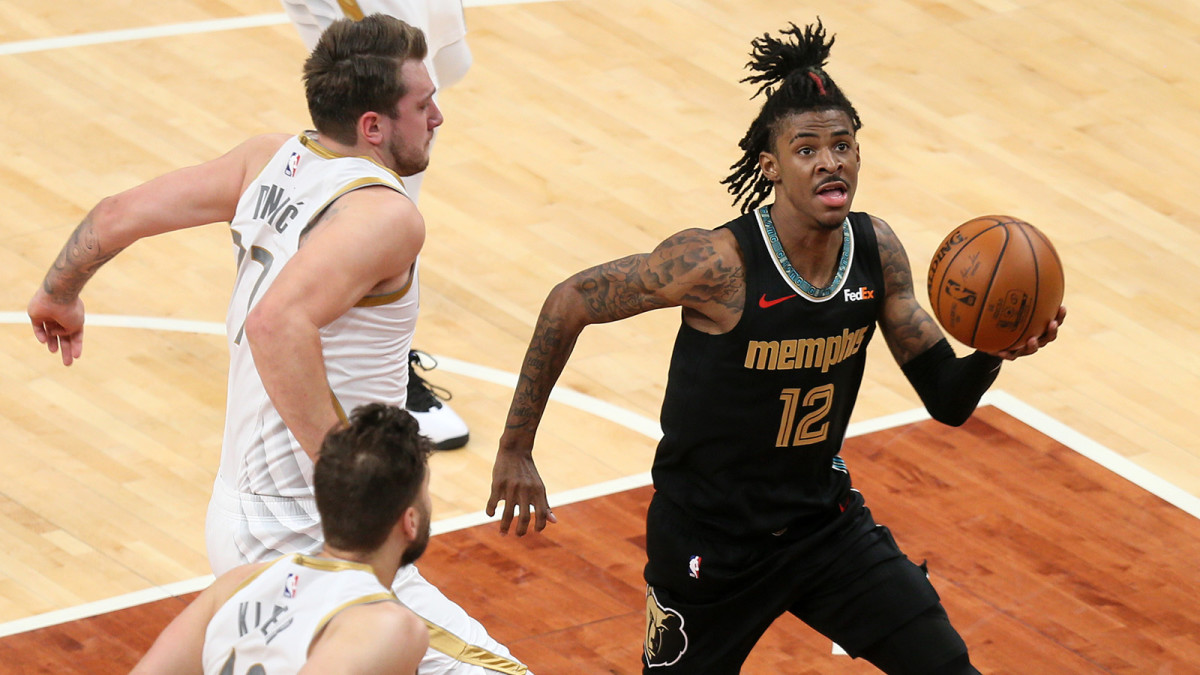 Grizzlies point guard Ja Morant holding a basketball