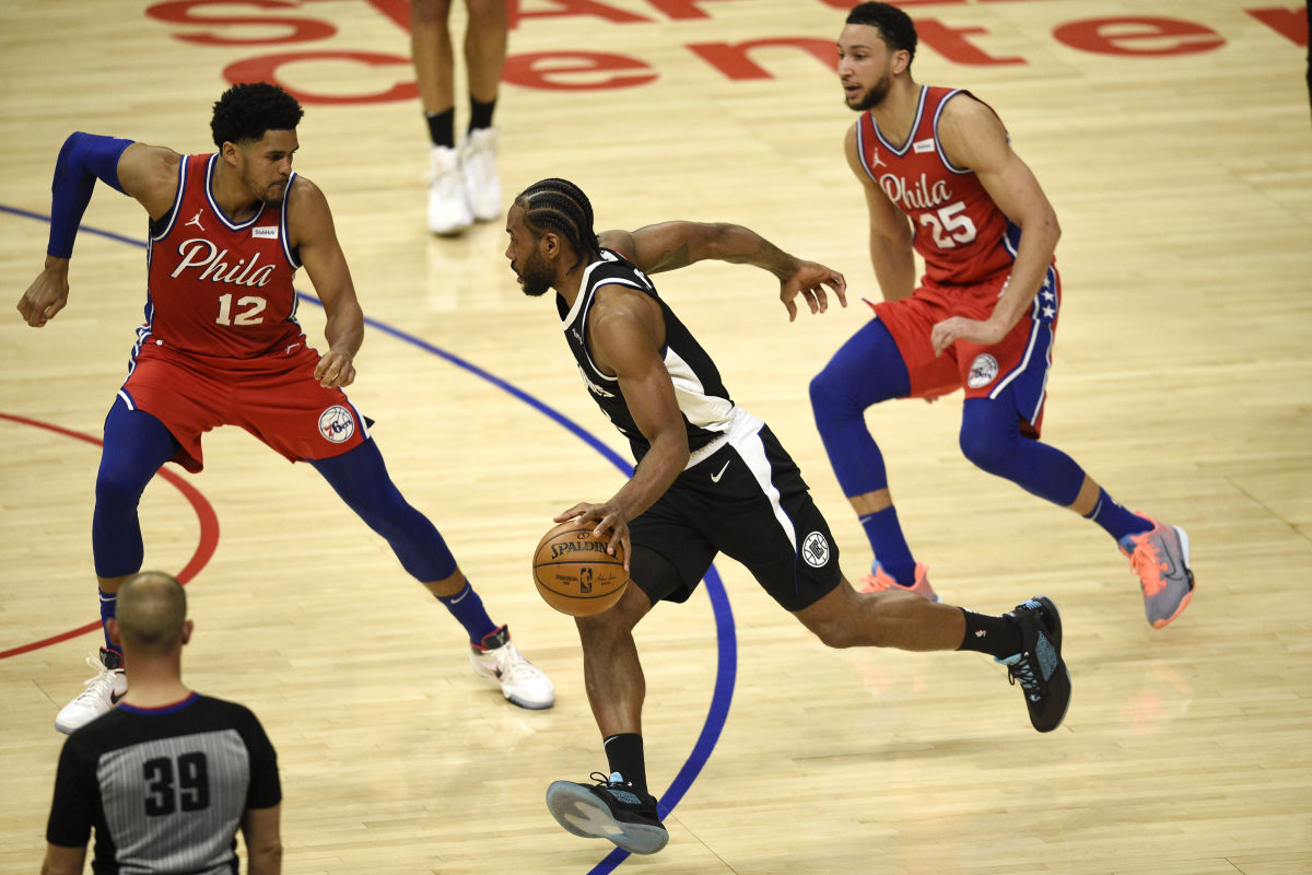 Mar 27, 2021; Los Angeles, California, USA; LA Clippers forward Kawhi Leonard (2) drives to the basket while Philadelphia 76ers forward Tobias Harris (12) defends during the first half at Staples Center. Mandatory Credit: Kelvin Kuo-USA TODAY Sports