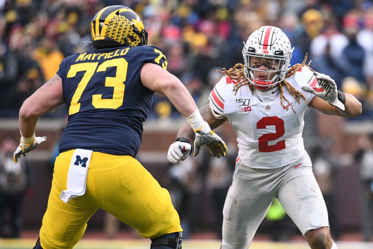 Nov 30, 2019; Ann Arbor, MI, USA; Ohio State Buckeyes defensive end Chase Young (2) battles for position with Michigan Wolverines offensive lineman Jalen Mayfield (73) during the game at Michigan Stadium. Mandatory Credit: Tim Fuller-USA TODAY Sports