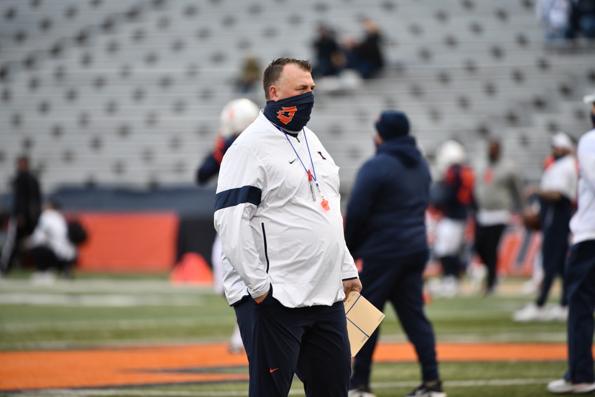 Illinois head coach Bret Bielema looks over pre-game warmups for the 2021 spring game on April 19, 2021. 