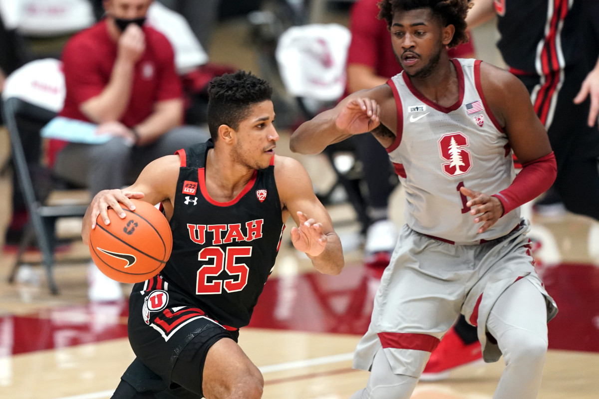 Utah Utes guard Alfonso Plummer (25) drives with the ball defended by Stanford Cardinal guard Daejon Davis (1) during the first half of a 2021 game at Maples Pavilion. 