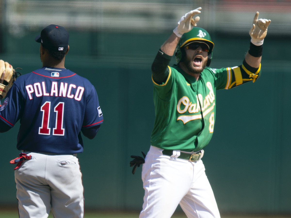 Oakland Athletics Jed Lowrie (8) celebrates his two-run double