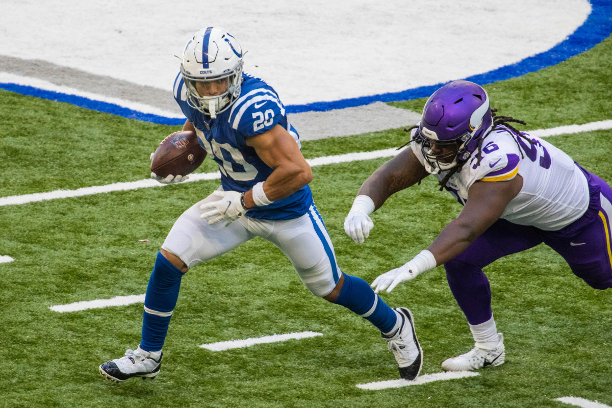 Sep 20, 2020; Indianapolis, Indiana, USA; Indianapolis Colts running back Jordan Wilkins (20) runs the ball while Minnesota Vikings defensive tackle Armon Watts (96) in the game at Lucas Oil Stadium. Mandatory Credit: Trevor Ruszkowski-USA TODAY Sports