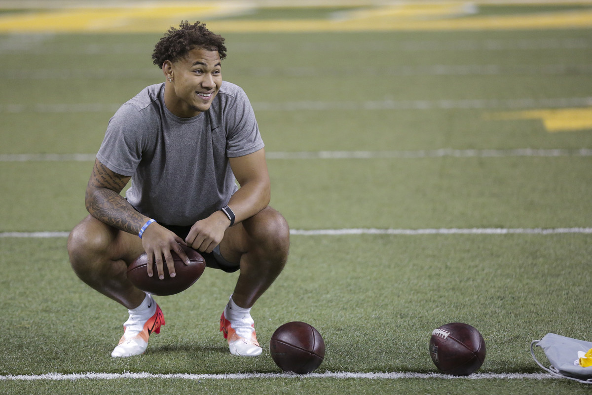 Trey Lance smiles during a break in his pro day performance