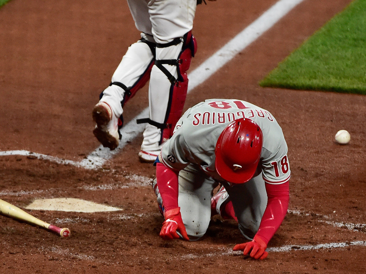 Philadelphia Phillies shortstop Didi Gregorius (18) falls to the ground after he was hit by a pitch from St. Louis Cardinals relief pitcher Genesis Cabrera