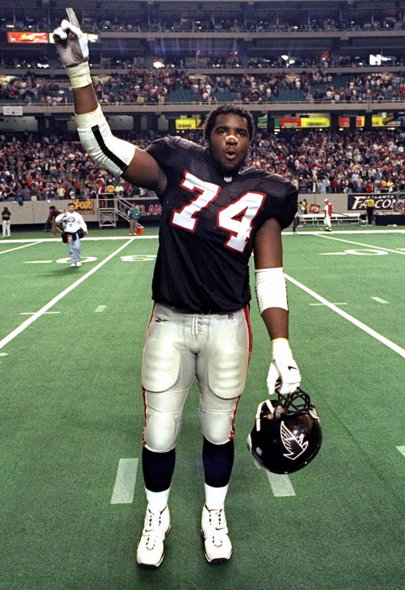 Falcons lineman Ephraim Salaam signals to the crowd while walking off the field