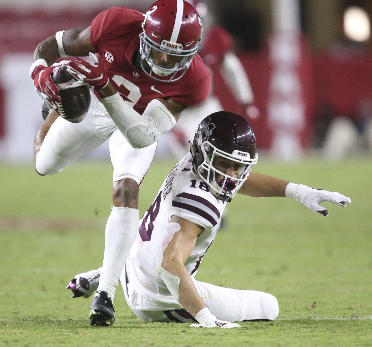 Alabama defensive back Patrick Surtain II (2) makes an interception he returned for a touchdown at Bryant-Denny Stadium during the second half of Alabama's 41-0 win over Mississippi State. The pass was inteded for Mississippi State wide receiver Cameron Gardner (18).