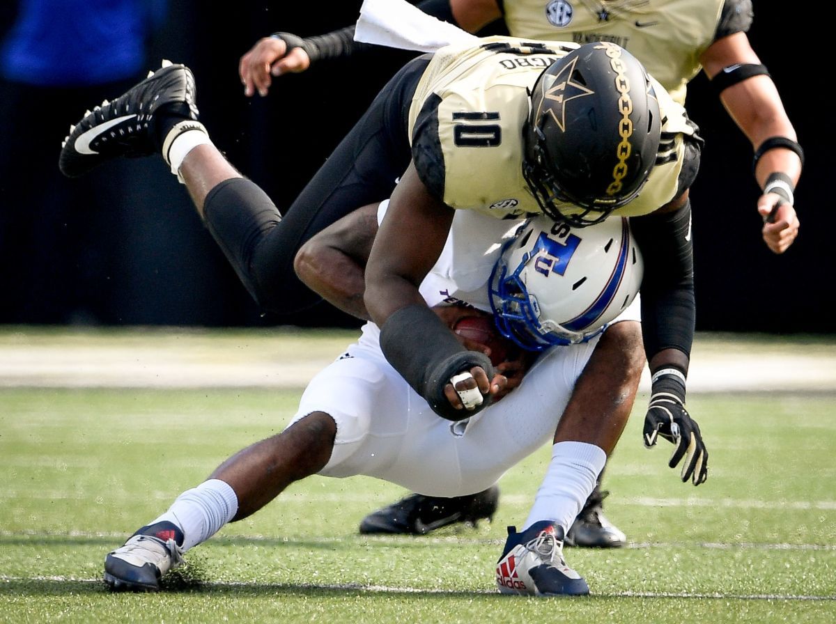 TSU quarterback Demry Croft (7) is sacked by Vanderbilt defensive lineman Dayo Odeyingbo (10) during the first half at Vanderbilt Stadium in Nashville, Tenn., Saturday, Sept. 29, 2018. Vandy Tsu An 092918 009