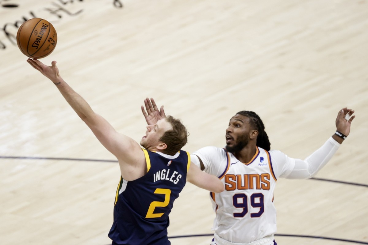 Joe Ingles (2) shoots over Jae Crowder (99) in a game against the Phoenix Suns