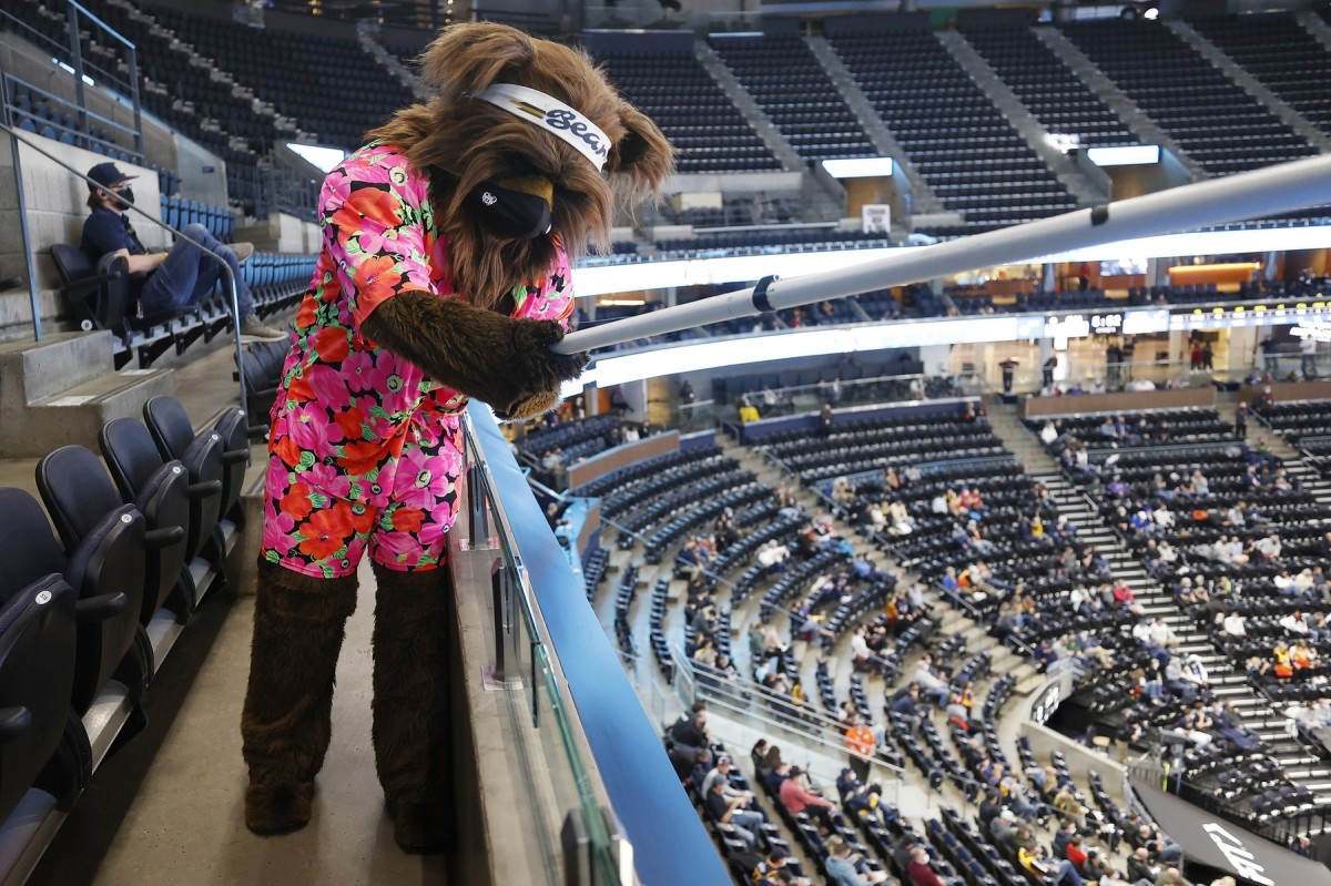 The Utah Jazz mascot, Bear, engages with socially distant fans at Vivint Smart Home Arena