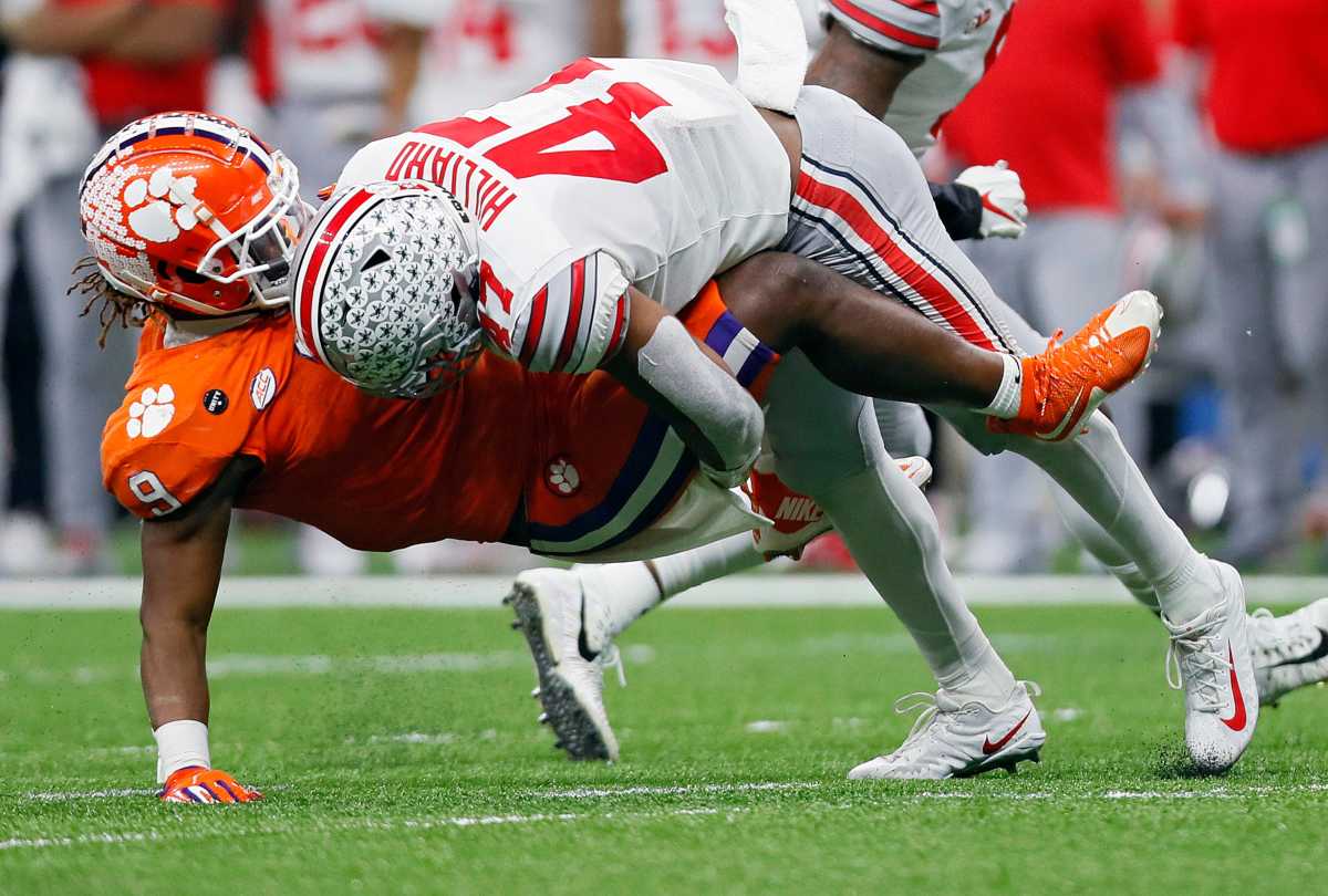 Ohio State Buckeyes linebacker Justin Hilliard (47) comes up with the tackle on Clemson Tigers running back Travis Etienne (9) in the third quarter during the College Football Playoff semifinal at the Allstate Sugar Bowl in the Mercedes-Benz Superdome in New Orleans on Friday, Jan. 1, 2021. College Football Playoff Ohio State Faces Clemson In Sugar Bowl