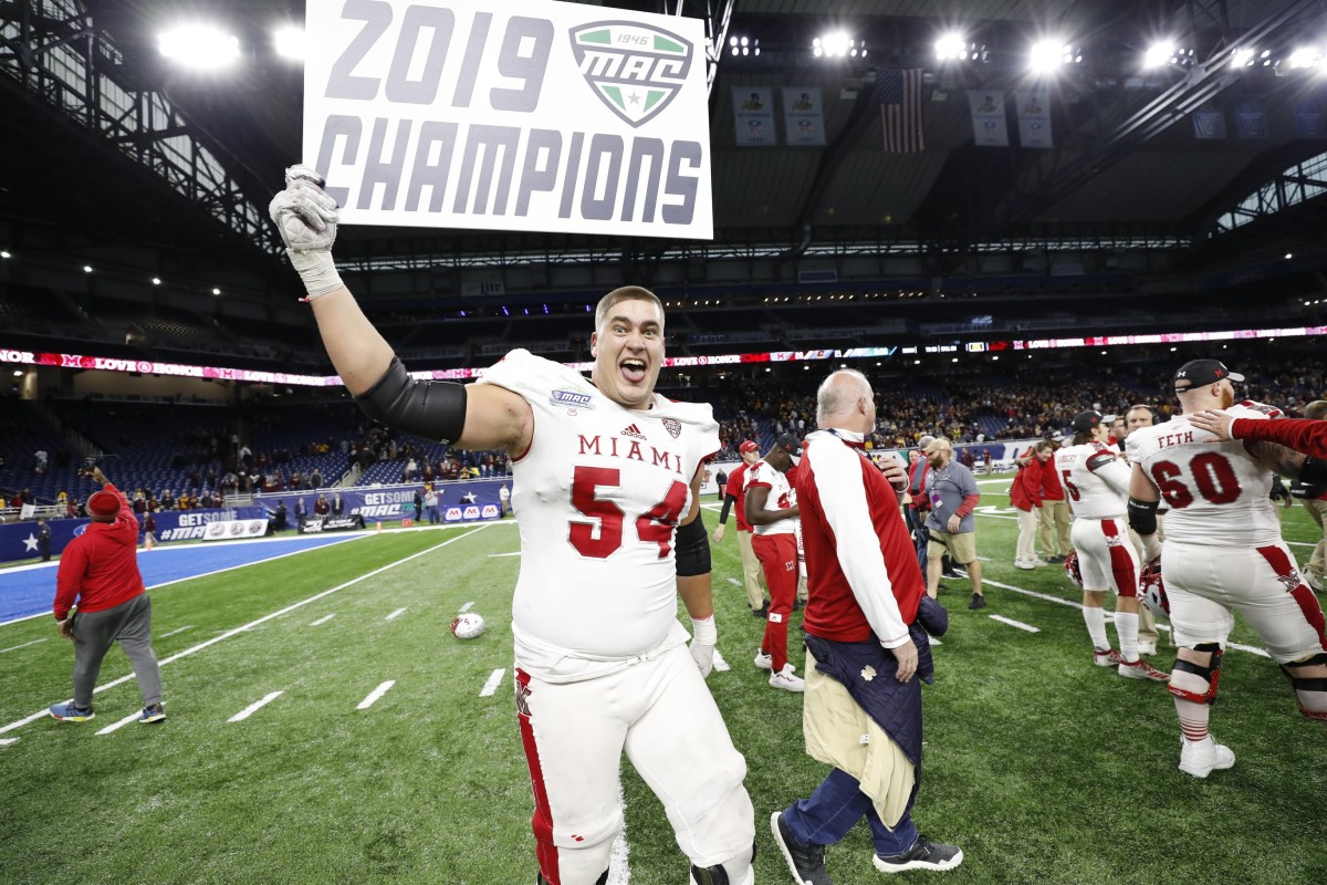 Miami Redhawks offensive lineman Tommy Doyle (54) celebrates after winning the MAC Championship game against the Central Michigan Chippewas at Ford Field.