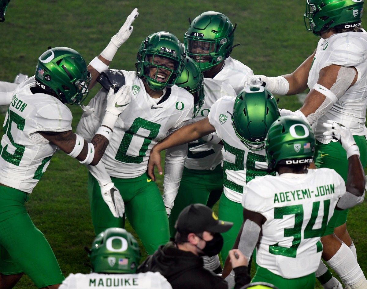 Oregon cornerback Deommodore Lenoir celebrates a first quarter interception against USC in the 2020 Pac-12 Championship Game in Los Angeles, California on December 18, 2020.