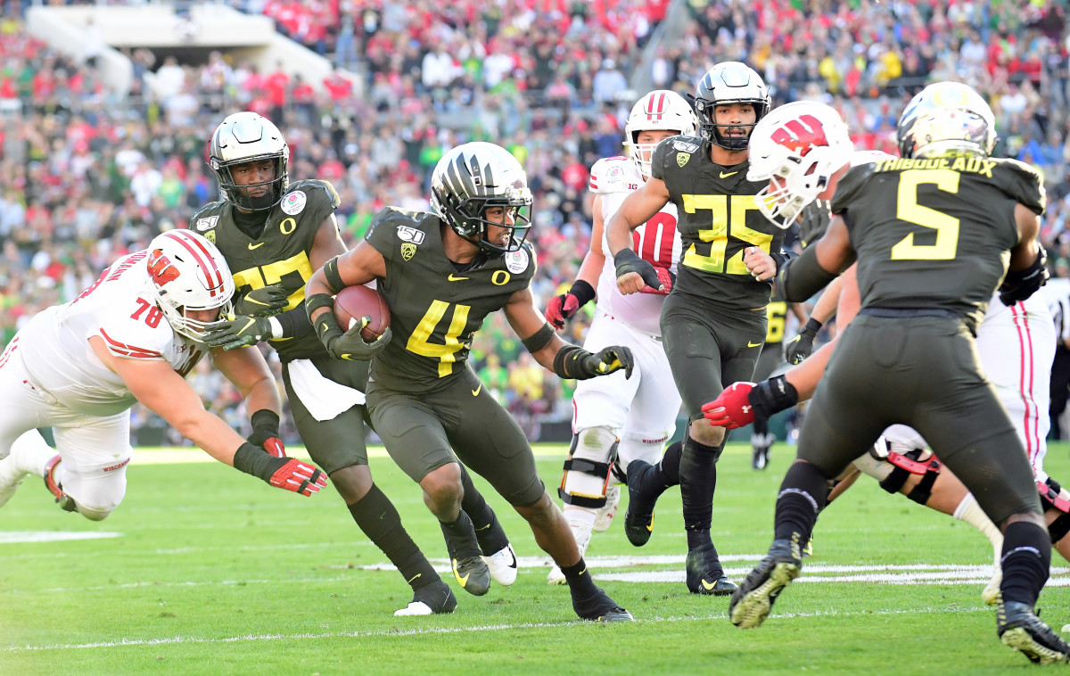 Thomas Graham (4), returns an interception against Wisconsin in the second quarter of the 2020 Rose Bowl in Pasadena, California, a slugfest of a game Oregon would win 28-27.