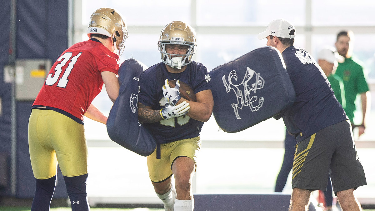 Notre Dame's Kyren Williams runs through padded blockers