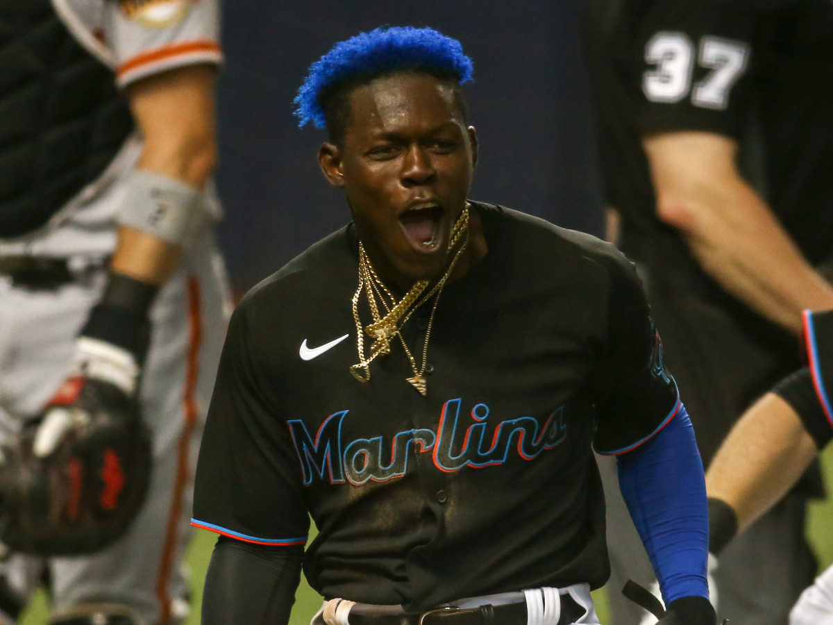 Miami Marlins second baseman Jazz Chisholm Jr. (2) celebrates after scoring the game-winning run against the San Francisco Giants in the tenth inning at loanDepot park.