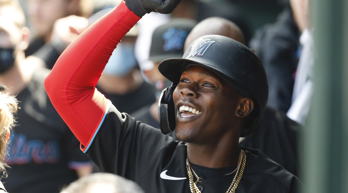 Miami Marlins second baseman Jazz Chisholm Jr. (2) is congratulated in the dugout after hitting a home run against the New York Mets during the second inning at Citi Field.