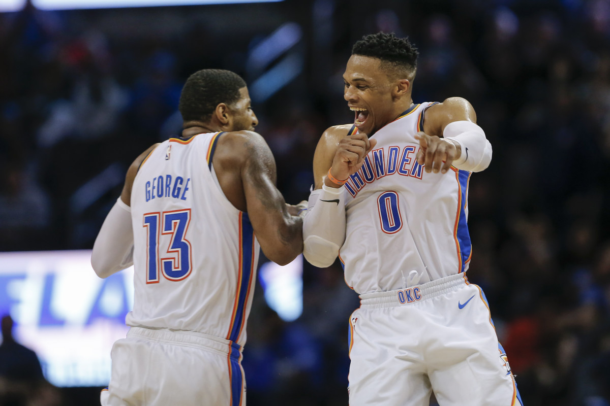 Feb 11, 2019; Oklahoma City, OK, USA; Oklahoma City Thunder guard Russell Westbrook (0) and forward Paul George (13) celebrate after Westbrook hit a three-point basket during the second half at Chesapeake Energy Arena. Oklahoma City won 120-111. Mandatory Credit: Alonzo Adams-USA TODAY Sports