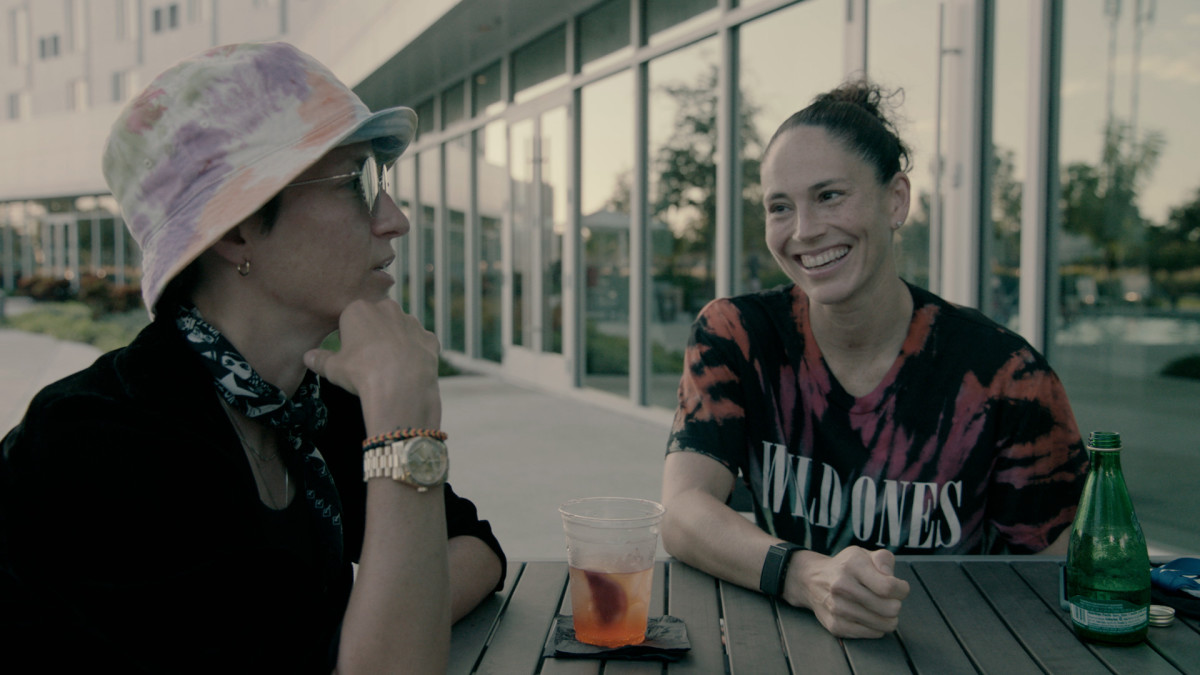 Megan Rapinoe and Sue Bird sitting at a table
