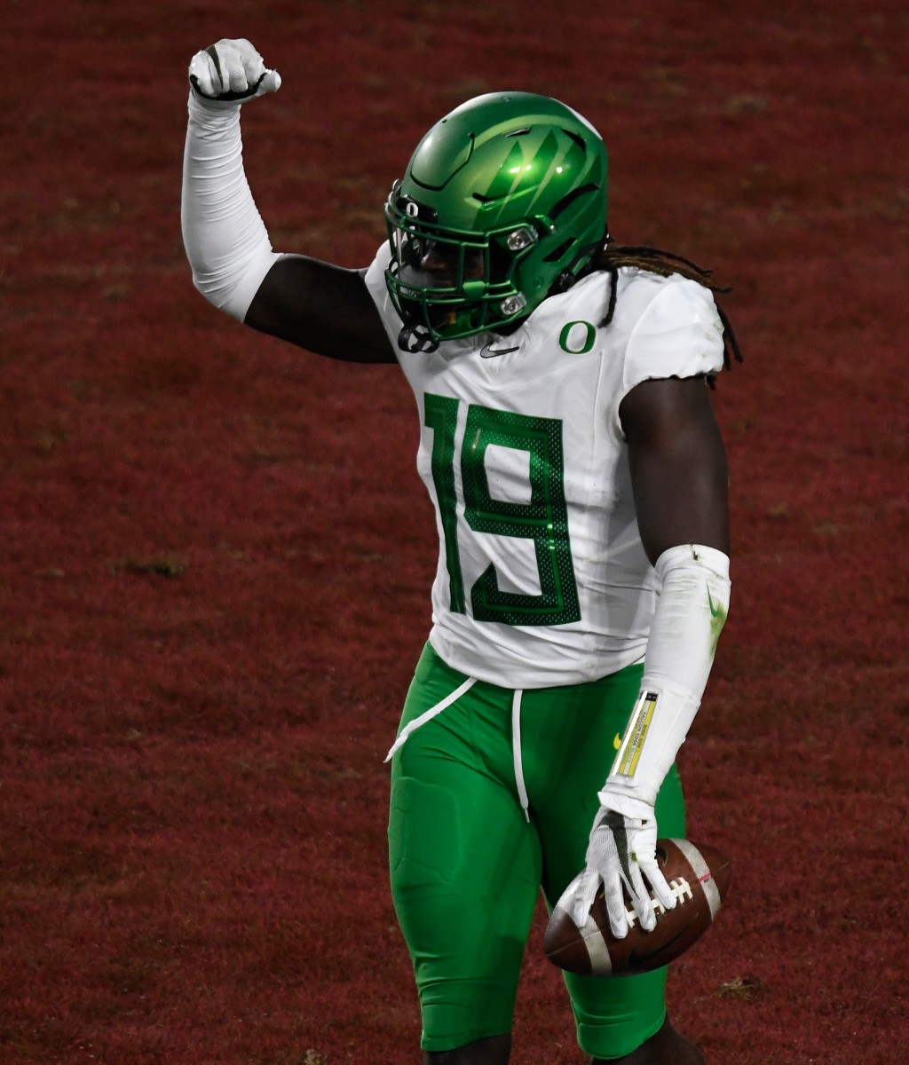 Jamal Hill celebrates an interception against USC in the 2020 Pac-12 Championship Game.