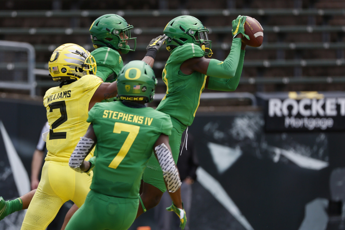 Dontae Manning intercepts a wide receiver reverse pass from Mycah Pittman in Oregon's 2021 spring football game.