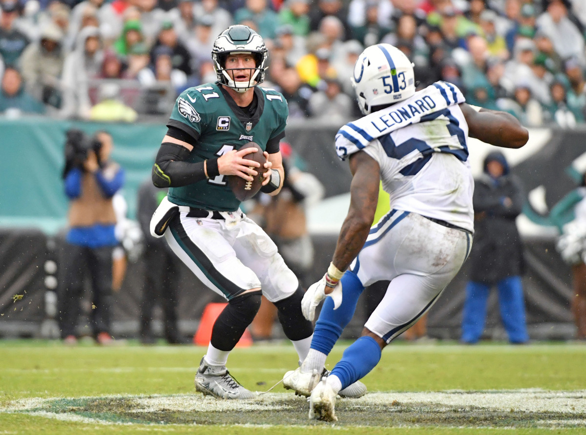 Sep 23, 2018; Philadelphia, PA, USA; Philadelphia Eagles quarterback Carson Wentz (11) is pressured by Indianapolis Colts linebacker Darius Leonard (53) during the third quarter at Lincoln Financial Field.
