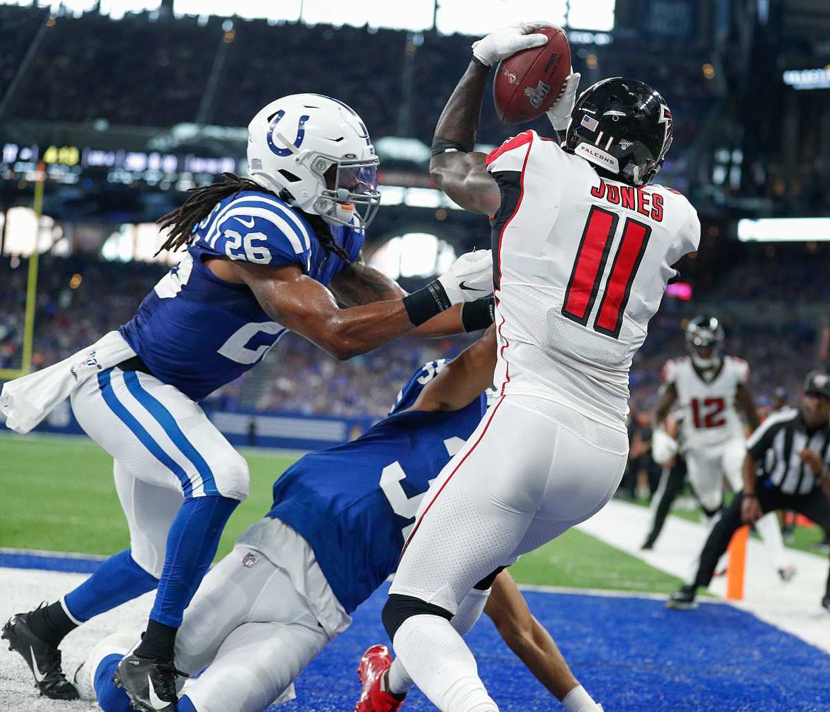 Atlanta Falcons wide receiver Julio Jones (11) catches a touchdown pass over Indianapolis Colts strong safety Clayton Geathers (26) and Quincy Wilson (31) in the second half of their game against the Atlanta Falcons at Lucas Oil Stadium on Sunday, Sept. 22., 2019. The Indianapolis Colts defeated the Atlanta Falcons 27-24. Indianapolis Colts Host Atlanta Falcons In Home Opener