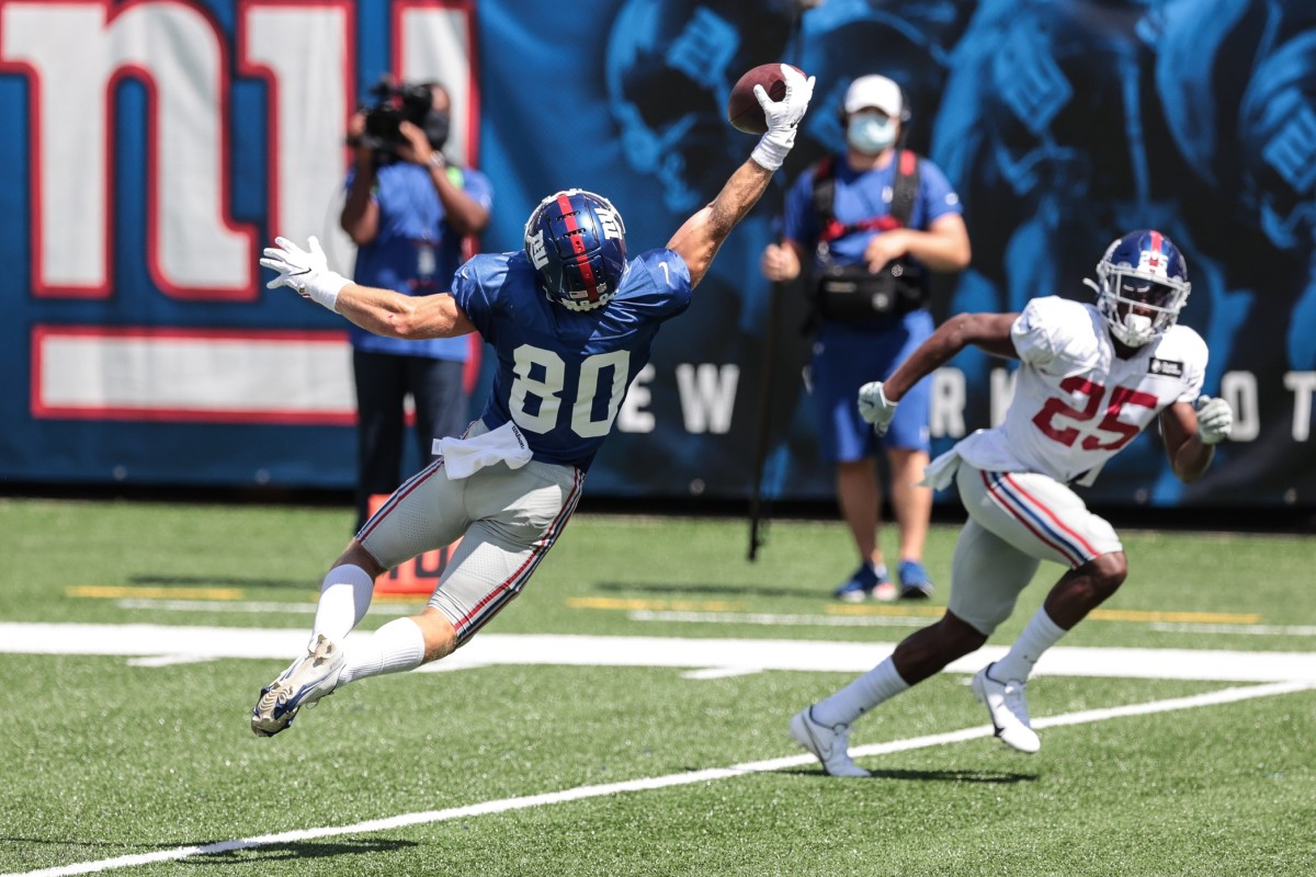 Sep 3, 2020; East Rutherford, New Jersey, USA; New York Giants wide receiver Alex Bachman (80) attempts to catch the ball in front of cornerback Corey Ballentine (25) during the Blue-White Scrimmage at MetLife Stadium.