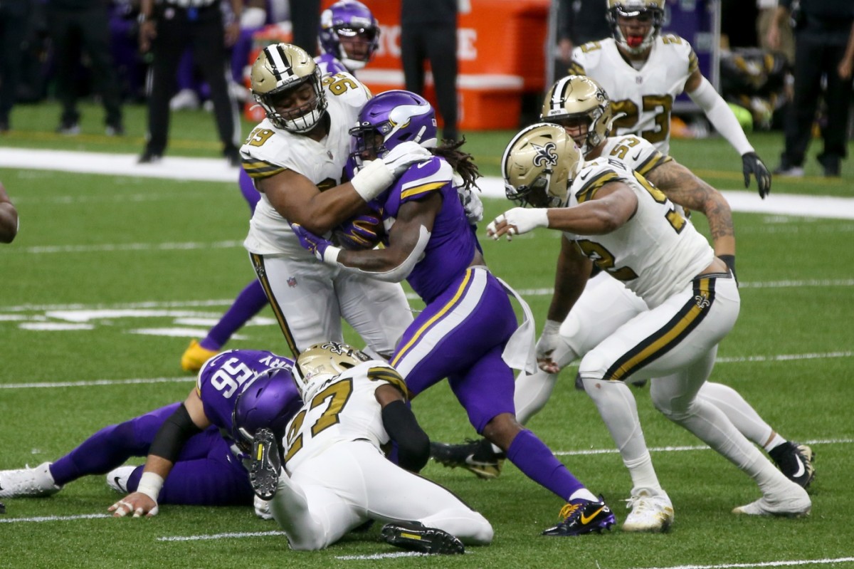 Vikings running back Dalvin Cook (33) is tackled by New Orleans defensive tackle Shy Tuttle (99). Mandatory Credit: Chuck Cook-USA TODAY