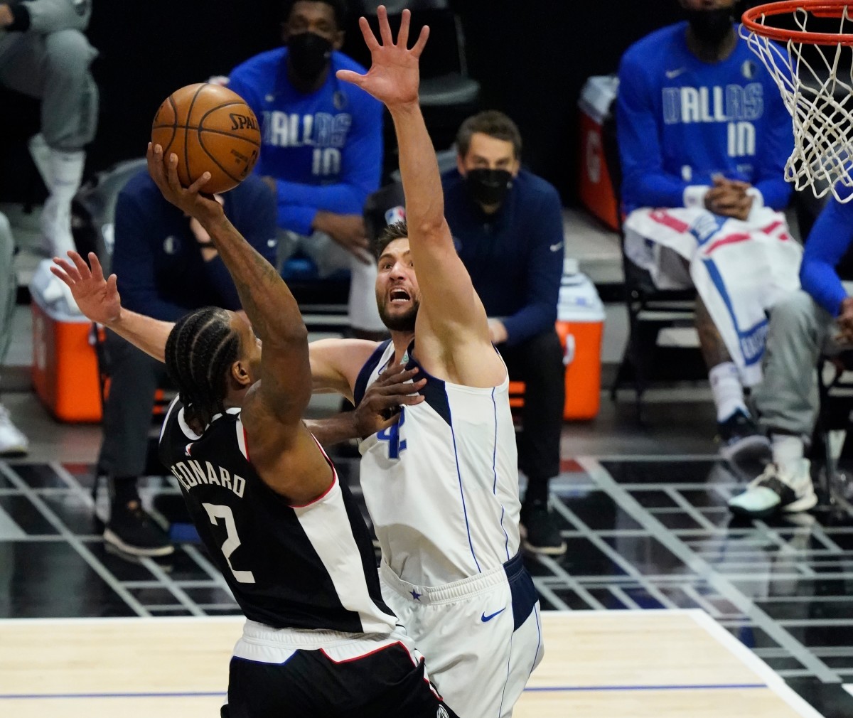 May 22, 2021; Los Angeles, California, USA; LA Clippers forward Kawhi Leonard (2) flies to the basket for a slam dunk over Dallas Mavericks forward Maxi Kleber (42) during the third quarter of game one in the first round of the 2021 NBA Playoffs at Staples Center. Mandatory Credit: Robert Hanashiro-USA TODAY Sports