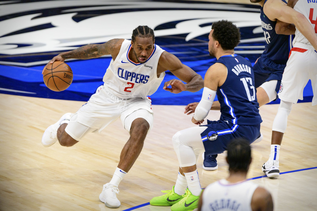 May 28, 2021; Dallas, Texas, USA; LA Clippers forward Kawhi Leonard (2) brings the ball up court past Dallas Mavericks guard Jalen Brunson (13) during the second half in game three in the first round of the 2021 NBA Playoffs at American Airlines Center. Mandatory Credit: Jerome Miron-USA TODAY Sports