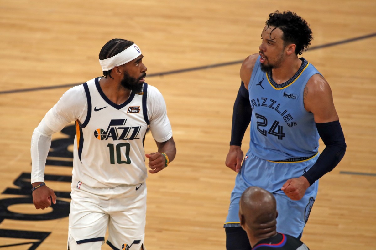 Mike Conley (10) stares down Dillon Brooks (24) after nailing a three pointer