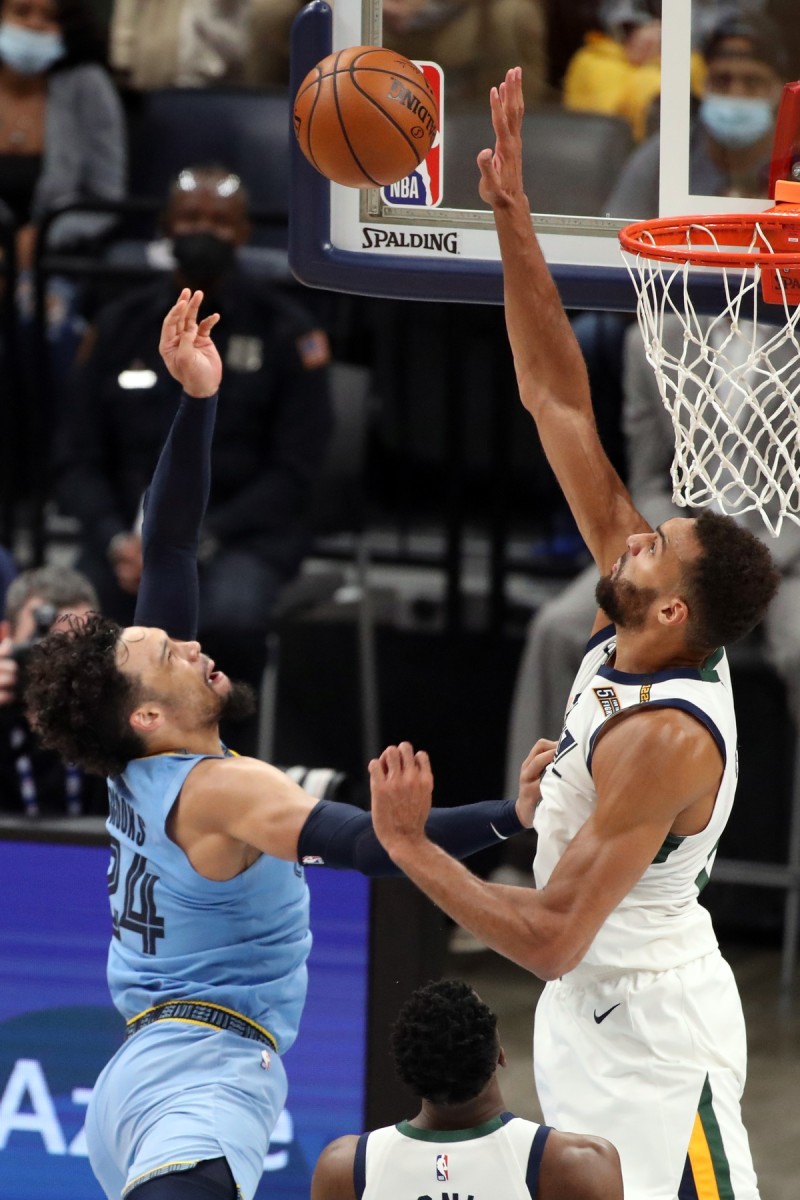 Rudy Gobert (27) looks to block a shot by Dillon Brooks (24)
