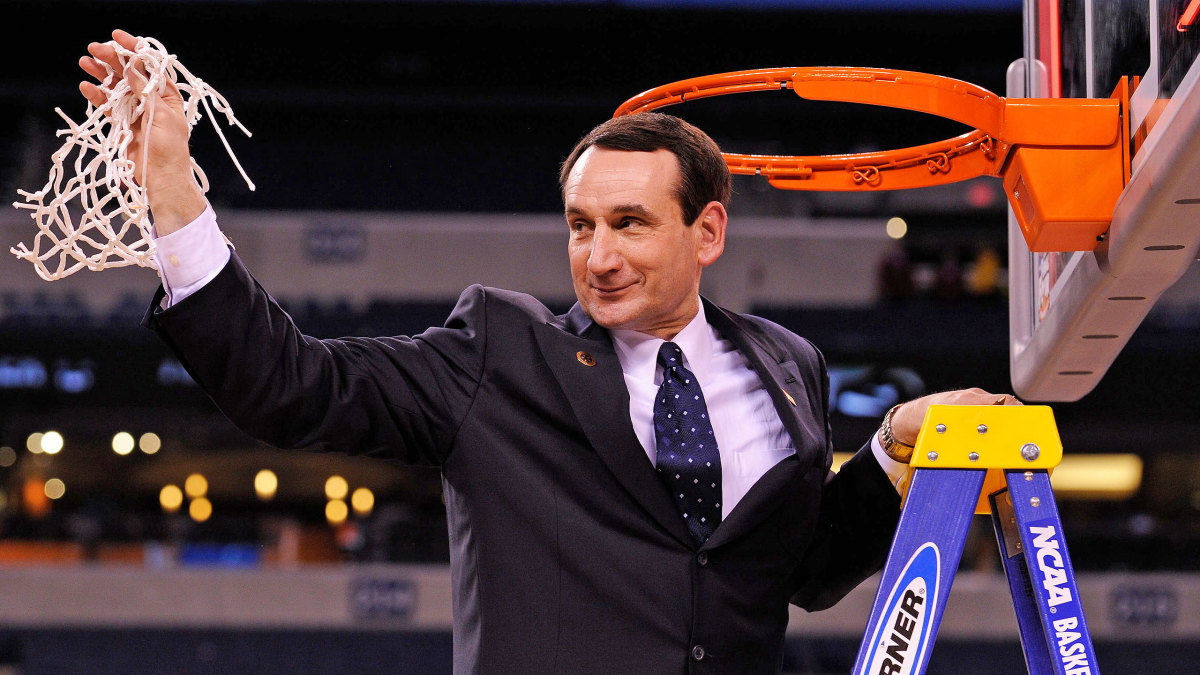 Duke's Mike Krzyzewski holds up the net after the 2010 national championship