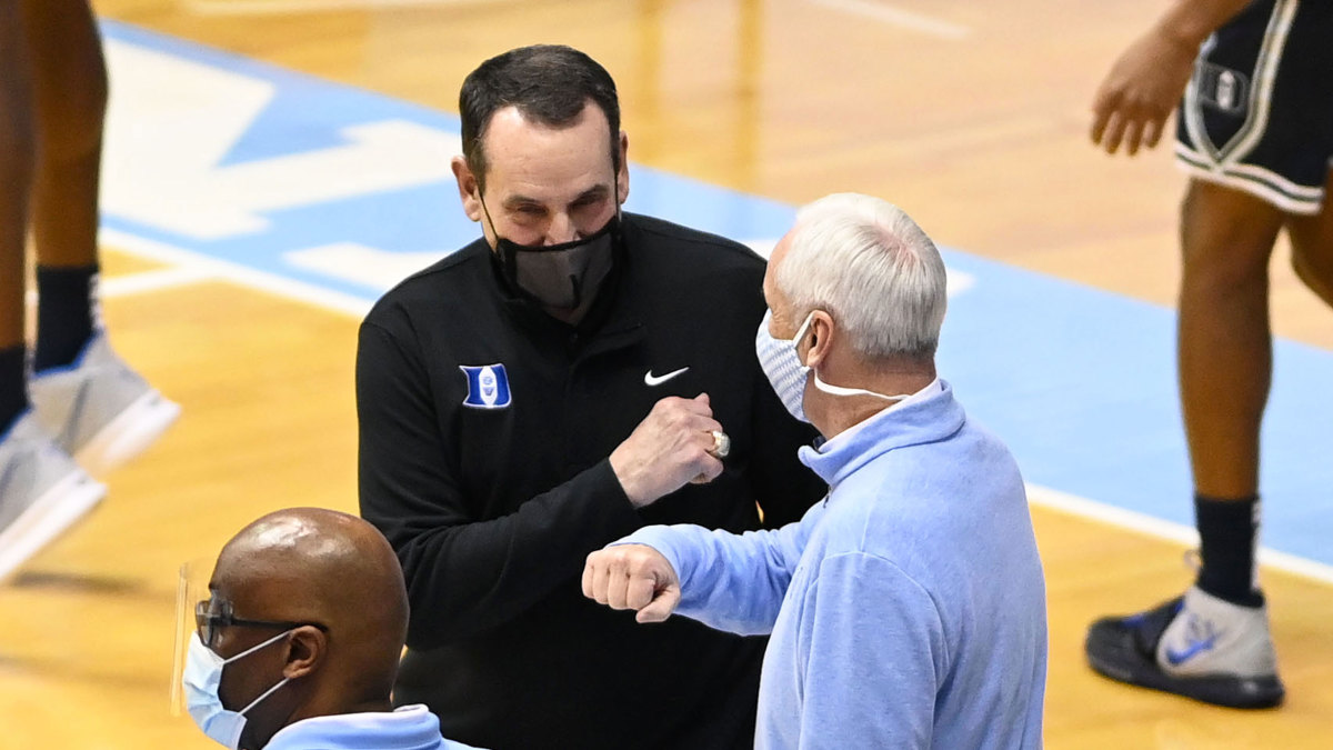 Coach K and Roy Williams first bump