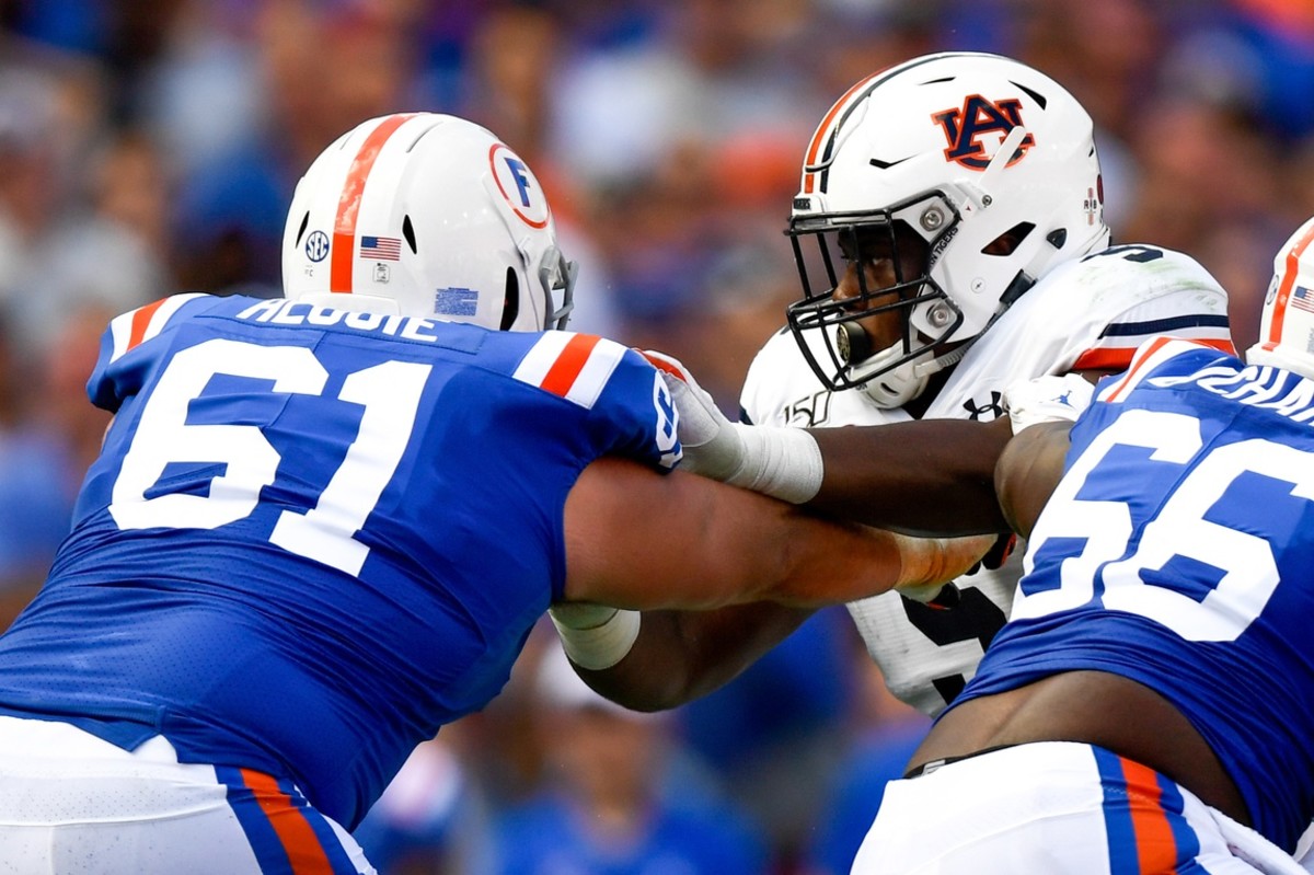 Oct 5, 2019; Gainesville, FL, USA; Auburn Tigers defensive tackle Derrick Brown (5) rushes the passer as Florida Gators offensive lineman Brett Heggie (61) defends during the second quarter at Ben Hill Griffin Stadium.