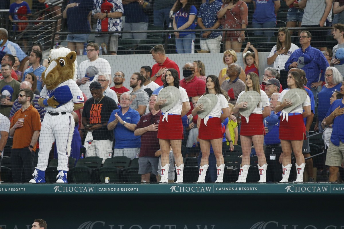 Jun 5, 2021; Arlington, Texas, USA; Texas Rangers mascot Captain and the Rangerettes stand during the playing of the national anthem in the seventh inning of a game against the Tampa Bay Rays at Globe Life Field.